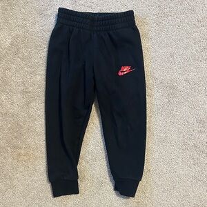 Nike Kids Black Sweatpants with Red Logo